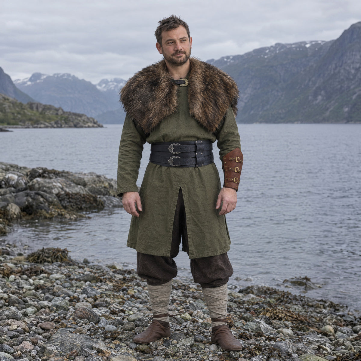 Wide double-buckle Celtic belt in a complete Viking outfit, worn by a man outdoors
