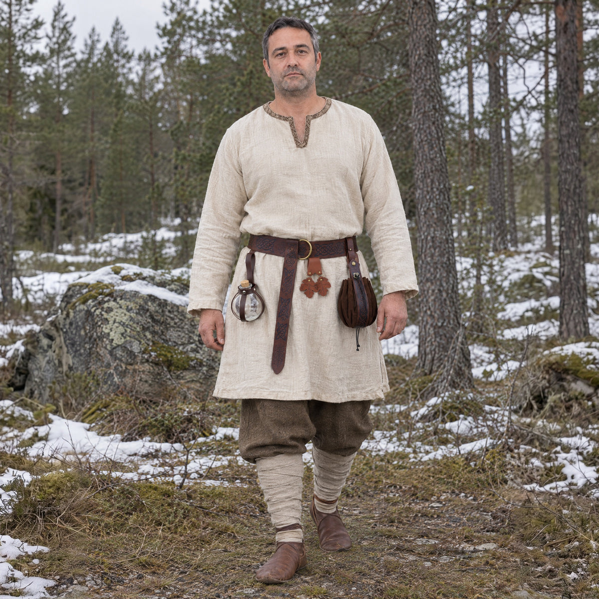 Brown wide ring belt kit with oak leaf hanger worn outdoors, full-length front view