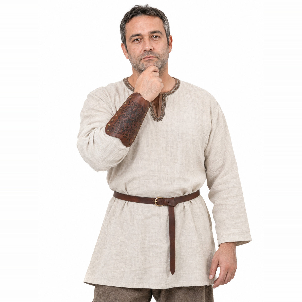 Brown winged beast rune bracer worn by a model on a white background