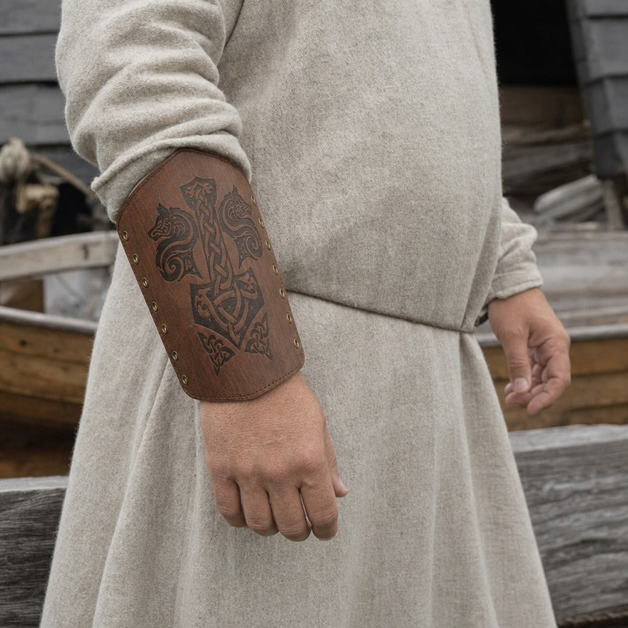 Wolf and hammer bracer on a forearm, showing the 24 cm length from wrist towards elbow