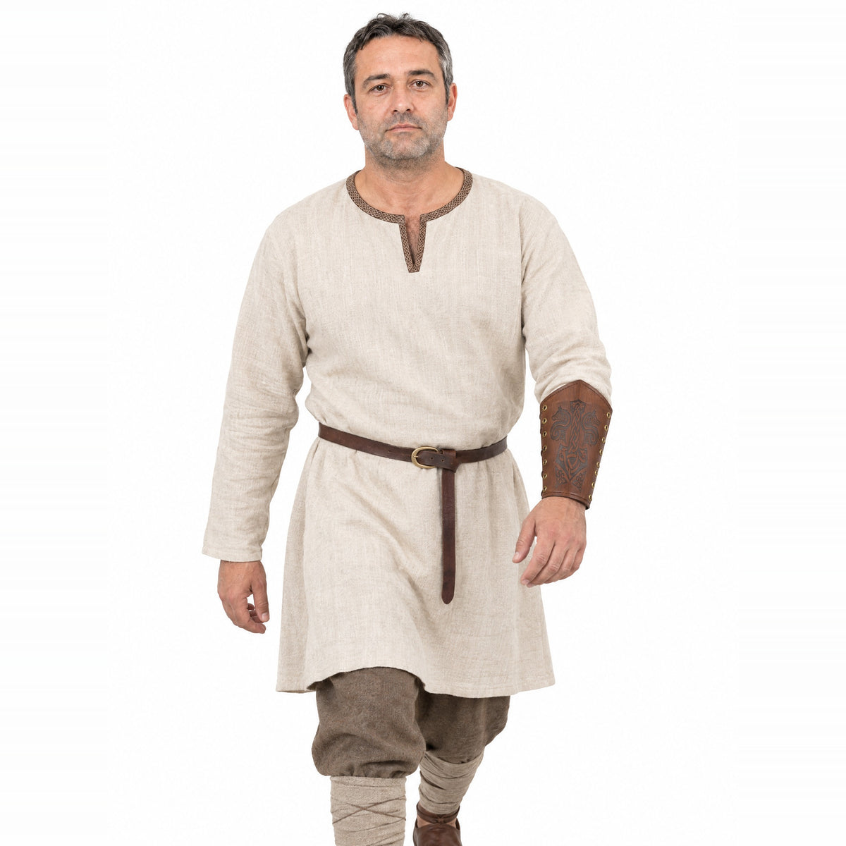 Light brown wolf and hammer bracer worn by a model on a white background
