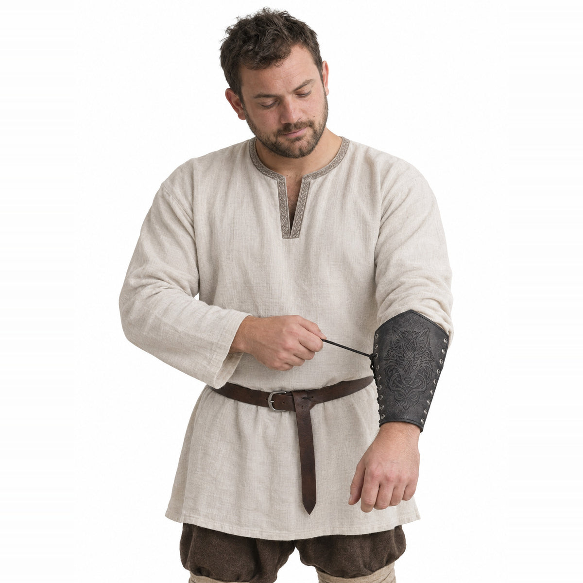 Grey wolf head bracer worn by a model on a white background